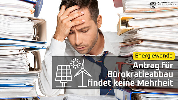 ltlsa/Canva Mann schlägt verzweifelt die Hände übereinander, weil er von Bürokratie erschlagen wird. Ein Antrag der Grünen zum Bürokratieabbau in der Klimapolitik fand keine Mehrheit.