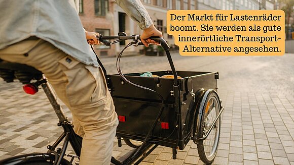 Foto von Lastenrad und Information: Der Markt für Lastenräder boomt. Sie werden als gute innerörtliche Transport-Alternative angesehen.